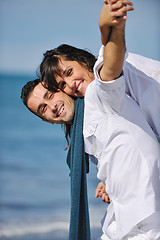 Image showing happy young couple have fun at beautiful beach