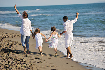 Image showing happy young  family have fun on beach