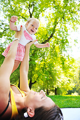 Image showing woman and baby have playing at park