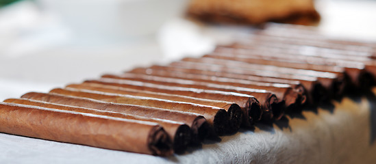 Image showing man making luxury handmade cuban cigare