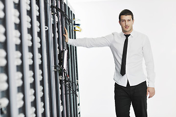 Image showing young it engeneer in datacenter server room