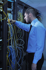 Image showing young it engineer in datacenter server room