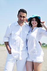 Image showing happy young couple have fun on beach