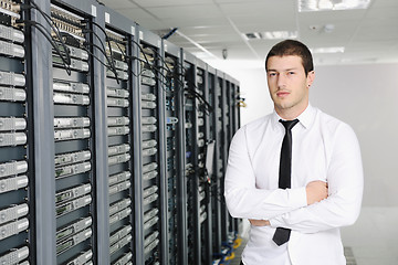 Image showing young it engeneer in datacenter server room