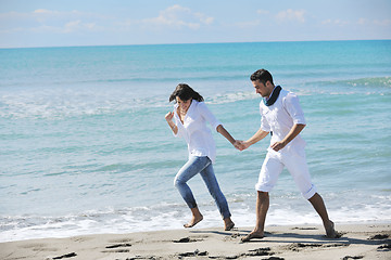 Image showing happy young couple have fun at beautiful beach