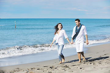 Image showing happy young couple have fun at beautiful beach