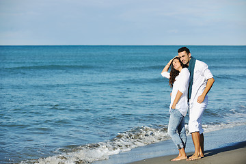 Image showing happy young couple have fun at beautiful beach