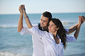 Image showing happy young couple have fun at beautiful beach