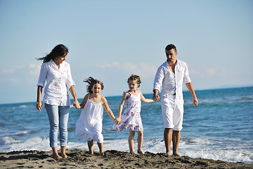 Image showing happy young  family have fun on beach