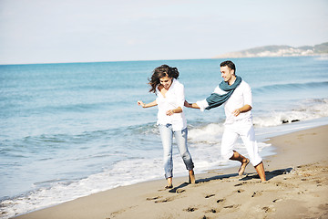 Image showing happy young couple have fun at beautiful beach