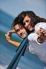 Image showing happy young couple have fun at beautiful beach