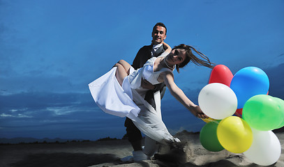 Image showing romantic beach wedding at sunset