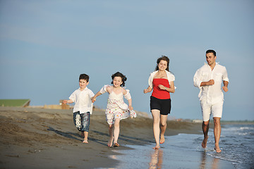 Image showing happy young family have fun on beach