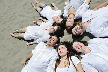 Image showing Group of happy young people in have fun at beach