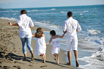 Image showing happy young  family have fun on beach