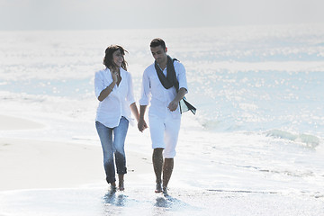 Image showing happy young couple have fun at beautiful beach