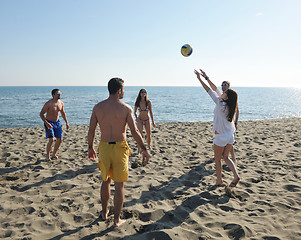 Image showing young people group have fun and play beach volleyball