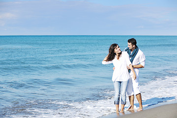 Image showing happy young couple have fun at beautiful beach