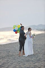 Image showing romantic beach wedding at sunset