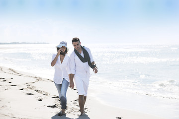 Image showing happy young couple have fun at beautiful beach