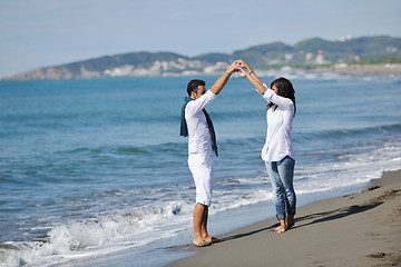 Image showing happy young couple have fun at beautiful beach