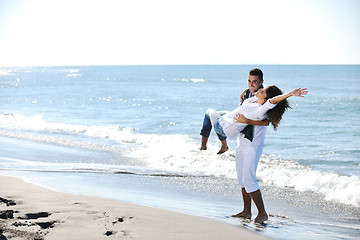 Image showing happy young couple have fun at beautiful beach