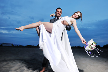 Image showing romantic beach wedding at sunset