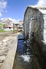 Image showing fresh mountain water falling on hands