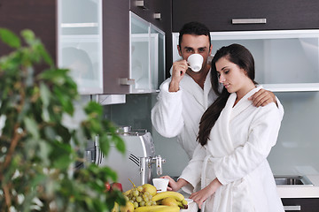 Image showing Young love couple taking fresh morning cup of coffee