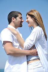 Image showing happy young couple have fun on beach