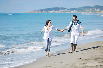 Image showing happy young couple have fun at beautiful beach