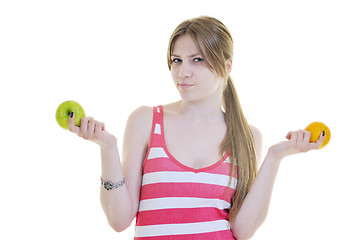 Image showing happy  young  woman eat apple isolated  on white