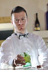 Image showing pro barman prepare coctail drink on party