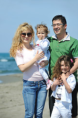 Image showing happy young family have fun on beach