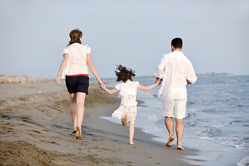 Image showing happy young family have fun on beach