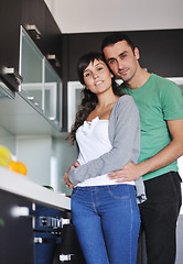 Image showing young couple have fun in modern kitchen