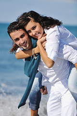 Image showing happy young couple have fun at beautiful beach