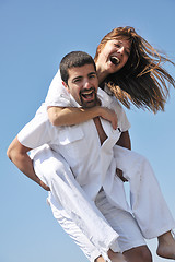 Image showing happy young couple have fun on beach