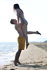 Image showing happy young couple have fun on beach