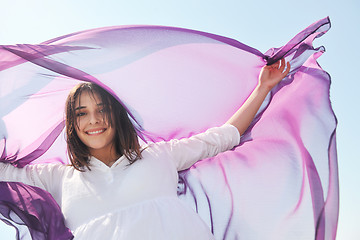 Image showing beautiful young woman on beach with scarf