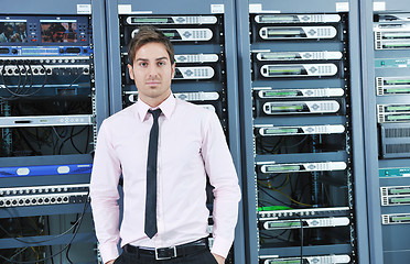 Image showing young it engeneer in datacenter server room