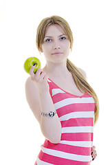 Image showing happy  young  woman eat green apple isolated  on white