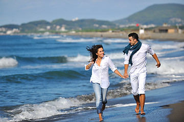 Image showing happy young couple have fun at beautiful beach