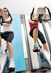 Image showing womanworkout  in fitness club on running track machine 