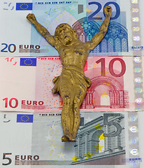 Image showing concept gold jesus crucify on euro banknotes