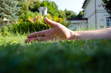 Image showing Human hand garden lawn retro building 