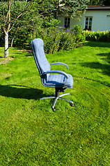 Image showing Boss chief office chair in garden lawn grass cut 