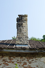 Image showing Ancient collapsing building wall roof and chimney 