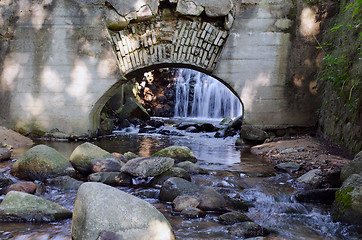 Image showing Retro architecture arch in wall and stream flow 