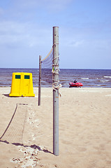 Image showing Volleyball net sea sand waste bin lifeguard boat 